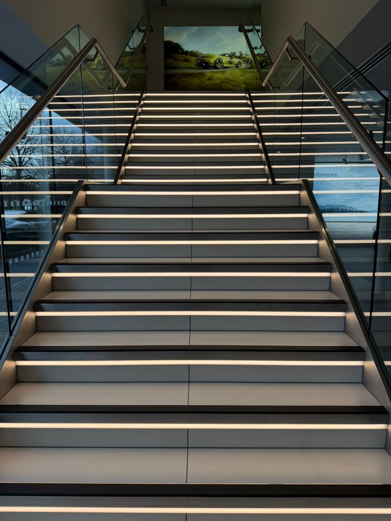 Porsche showroom staircase cleaned by Signature Cleans commercial cleaning, Exeter